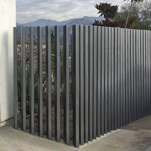 Unique upright grey metal fence